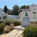 Bronze memorial bust in front of an Orthodox church in Spetses town Greece