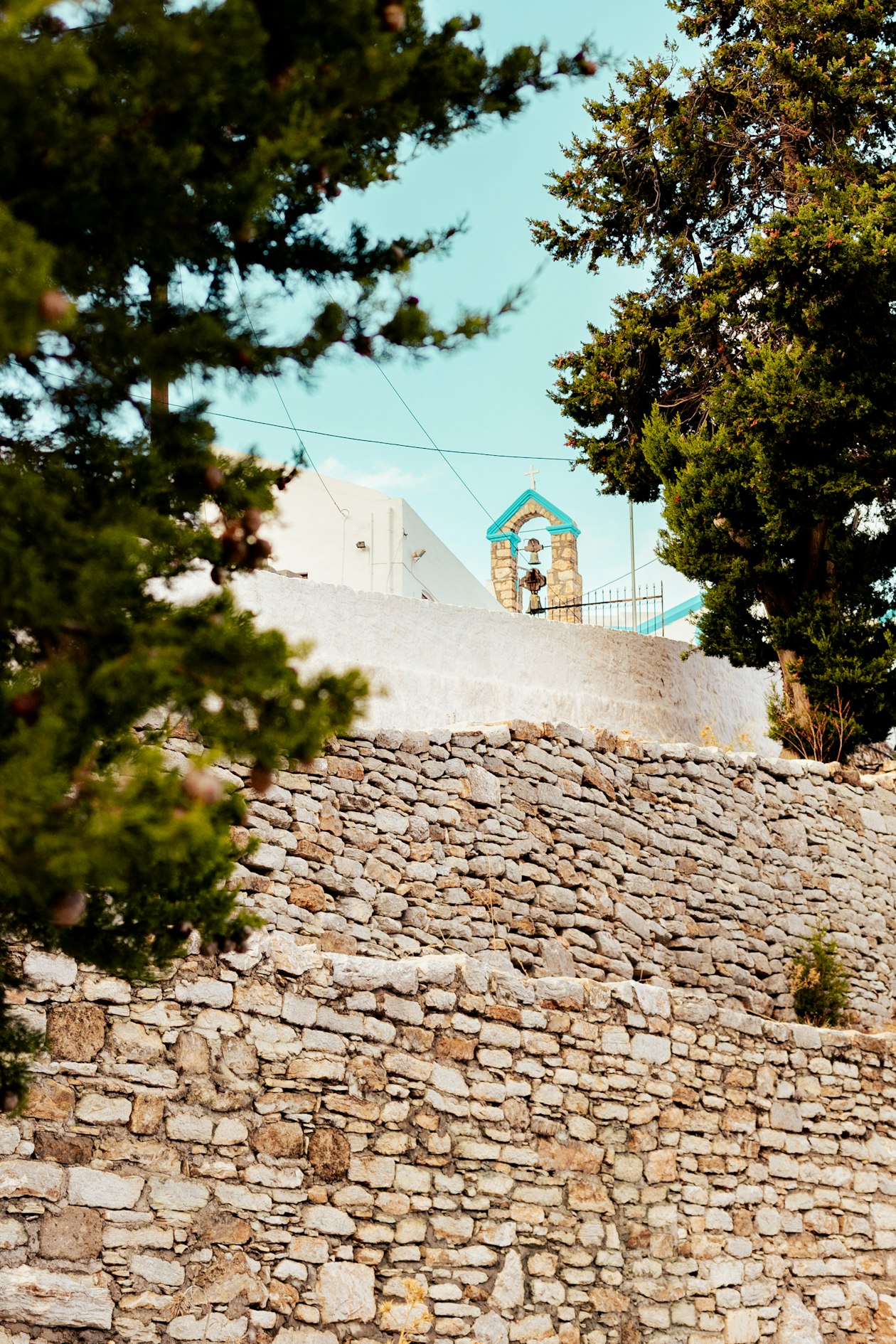 The Petrideio clock tower in Symi town, built in 1881, a landmark of Gialos harbour, Greece