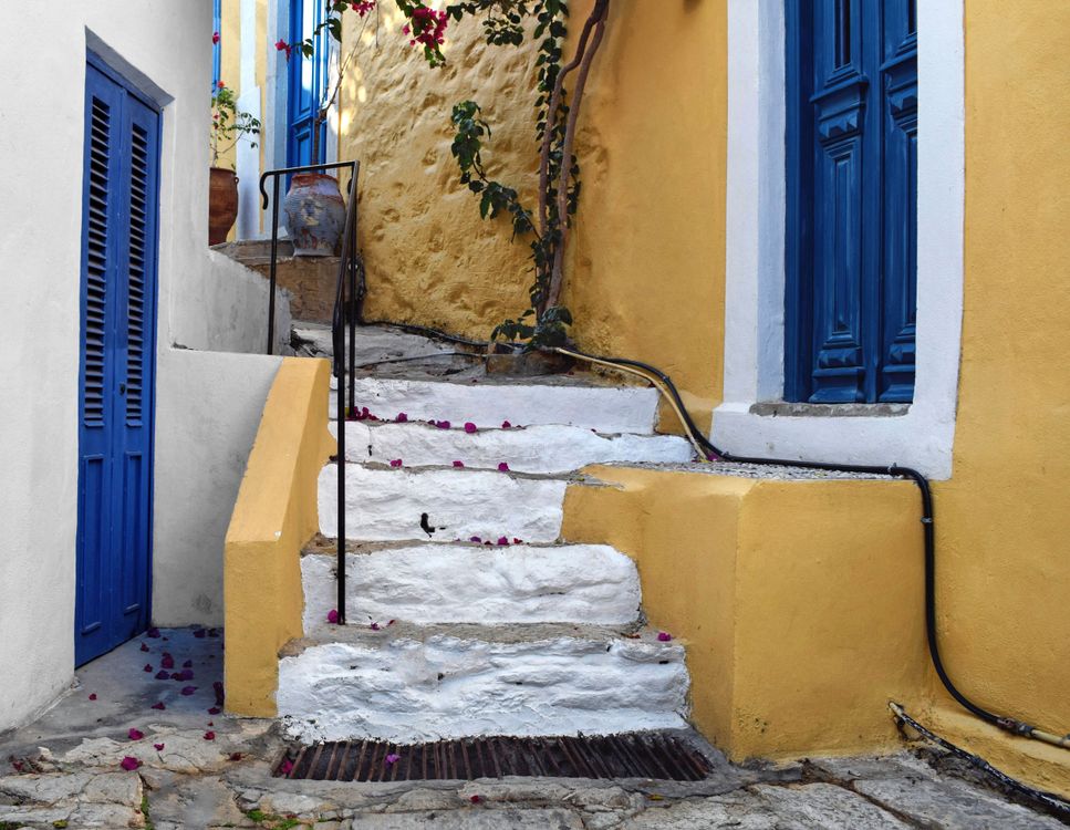 Colourful stone steps and doorways along the alleys of Ano Symi, Greece
