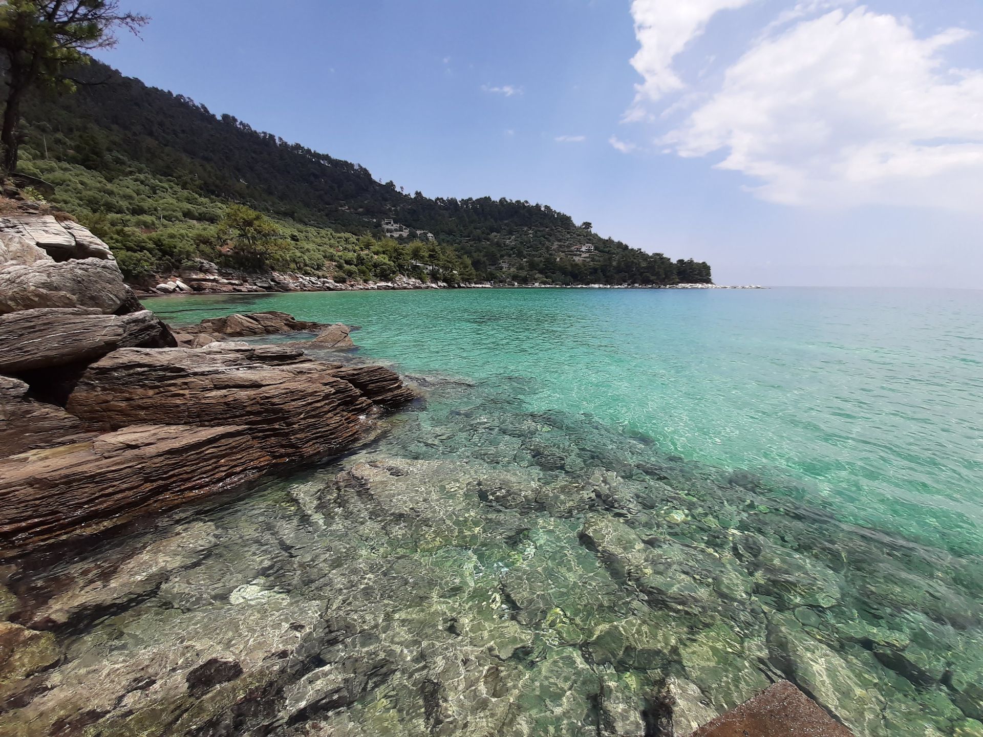 Golden Beach Chrisi Ammoudia Thasos with crystal clear waters and lush green coastline