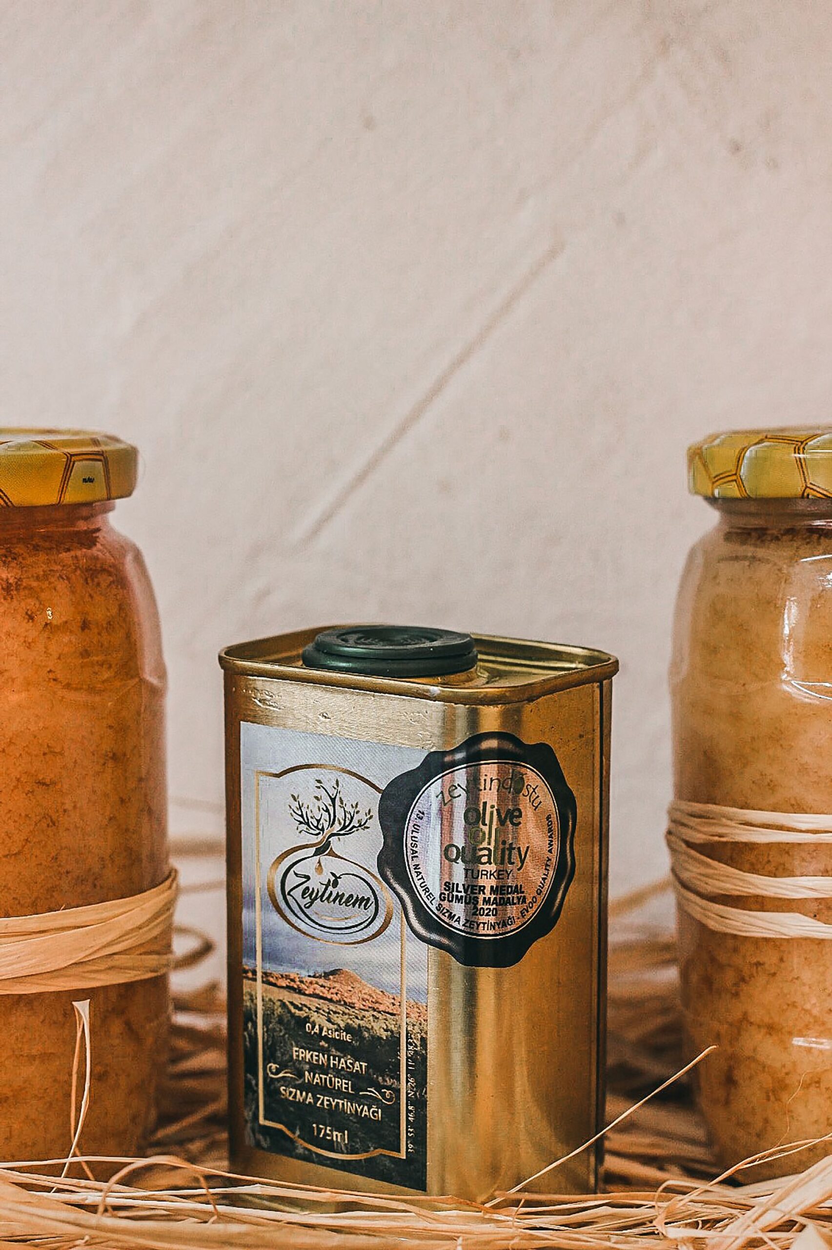 Traditional olive oil and honey jars representing local Thasos food products