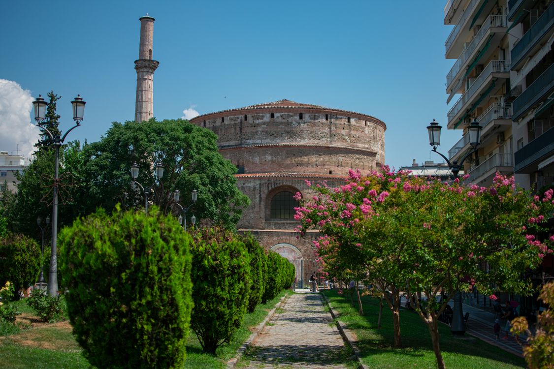 The Rotunda of Galerius in Thessaloniki, a massive cylindrical Roman monument surrounded by green gardens