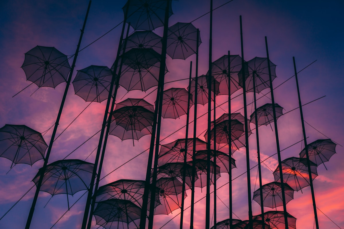 The Zongolopoulos umbrella sculpture installation on the Thessaloniki waterfront, black umbrella shapes hanging against the sky
