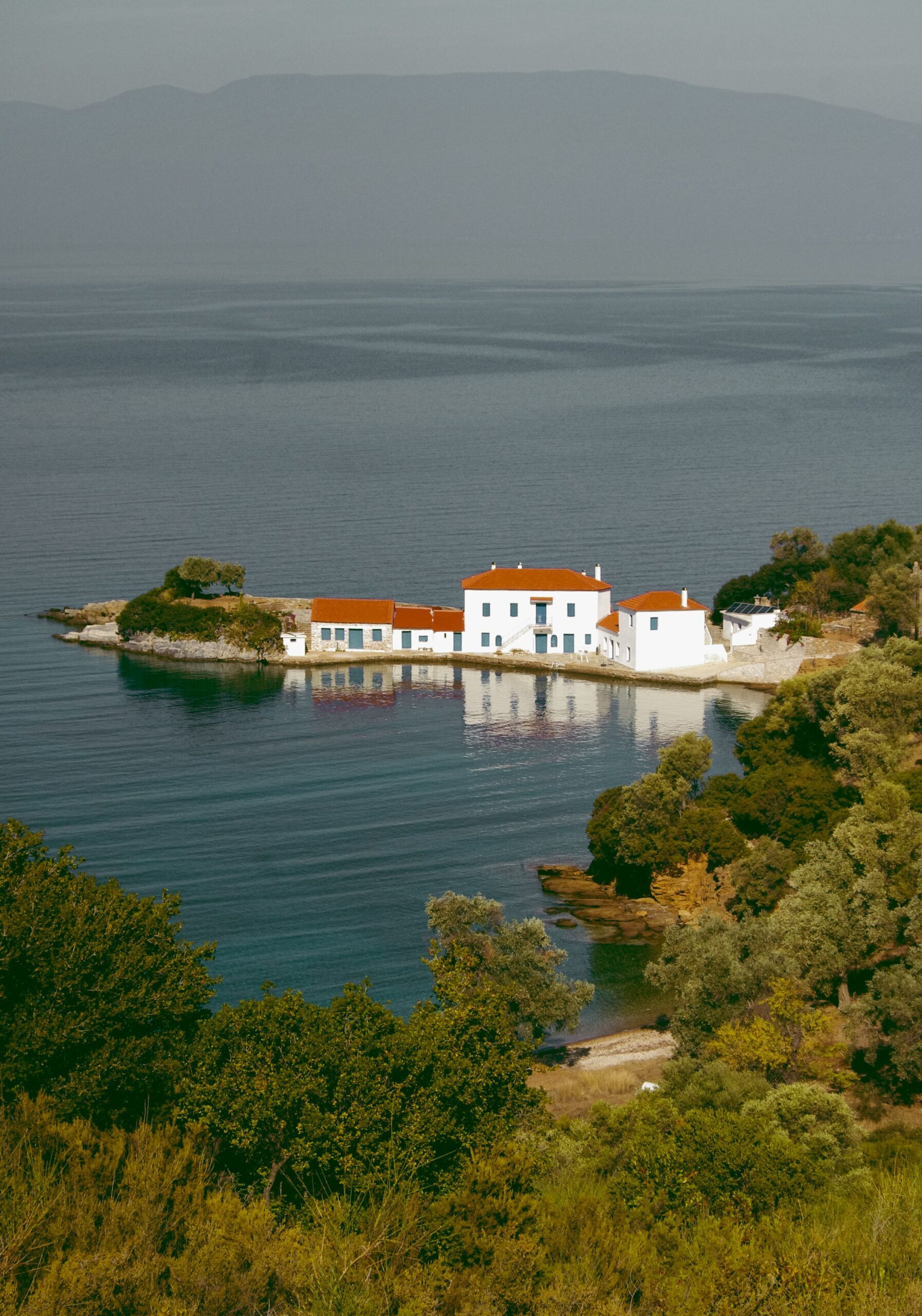Coastal village of Tzasteni near Milina in southern Pelion with traditional white houses above the sea