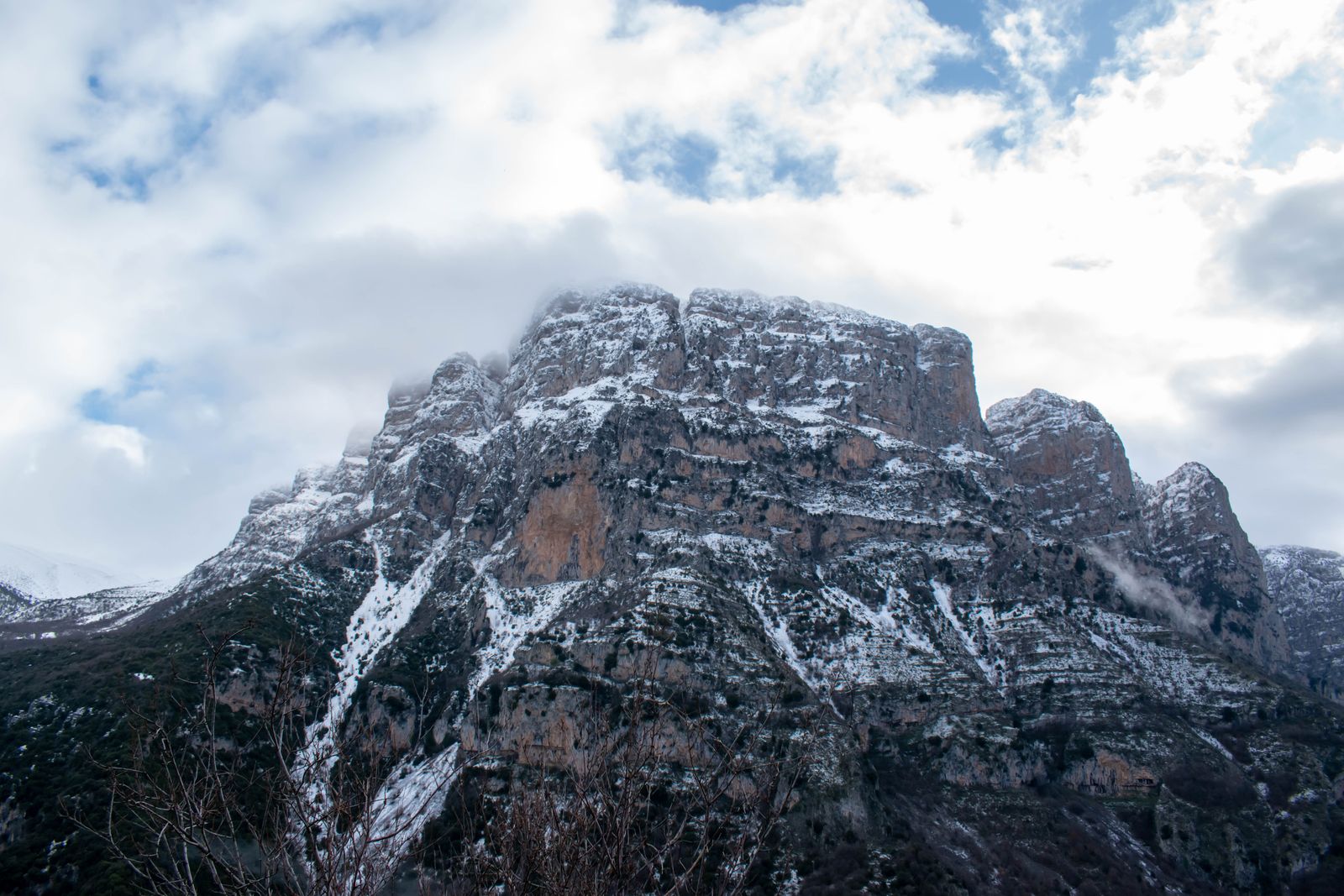 Snow-capped peaks of Mount Tymphi above the village of Papingo in Zagori, Epirus