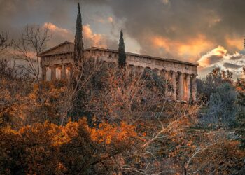 Temple of Hephaestus in Athens surrounded by autumn foliage in October