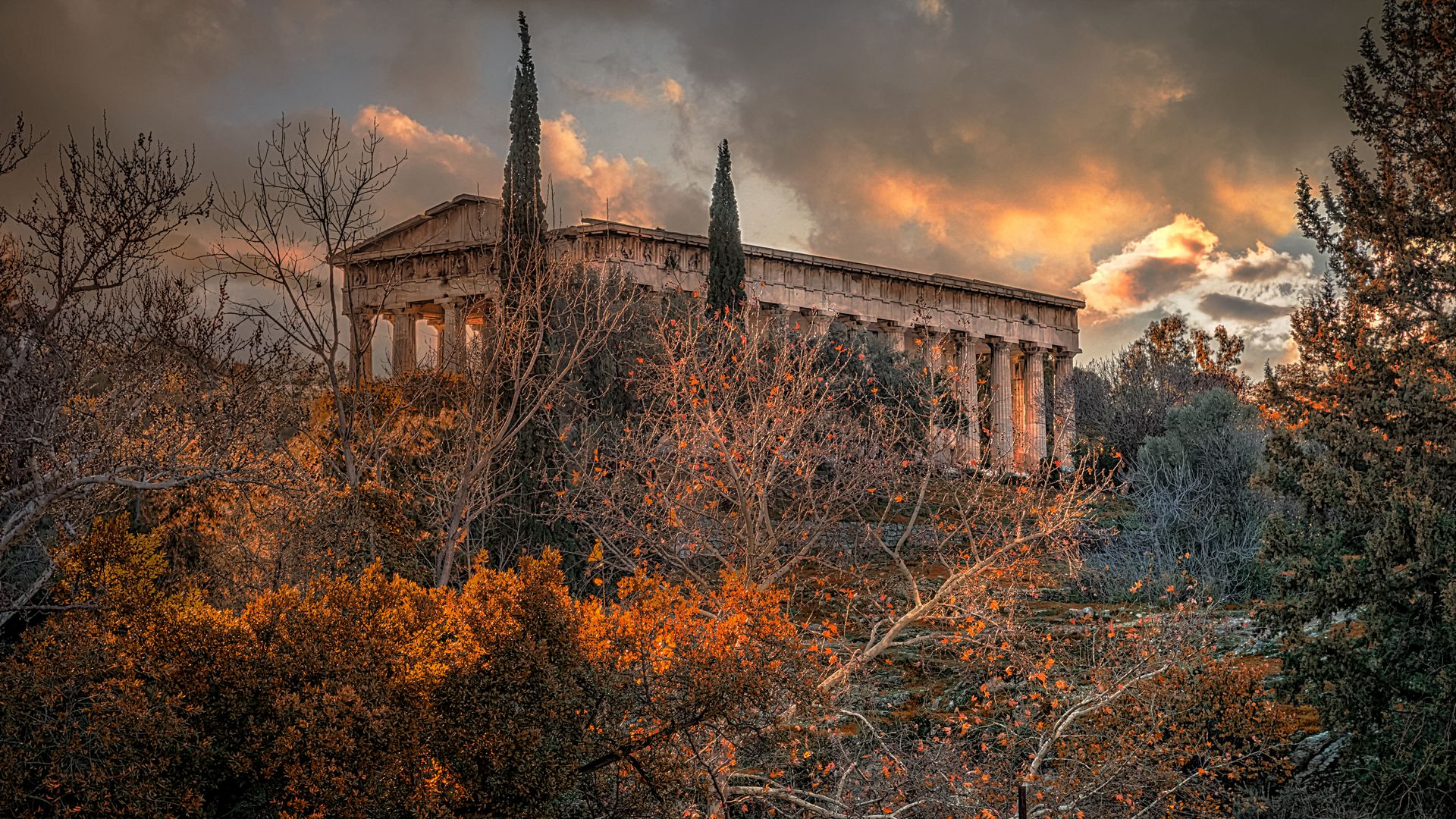 Temple of Hephaestus in Athens surrounded by autumn foliage in October