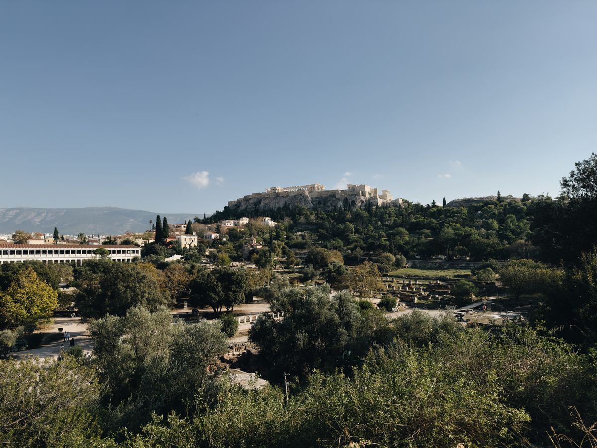 Panoramic view of the Athens Acropolis and surrounding cityscape on a clear day