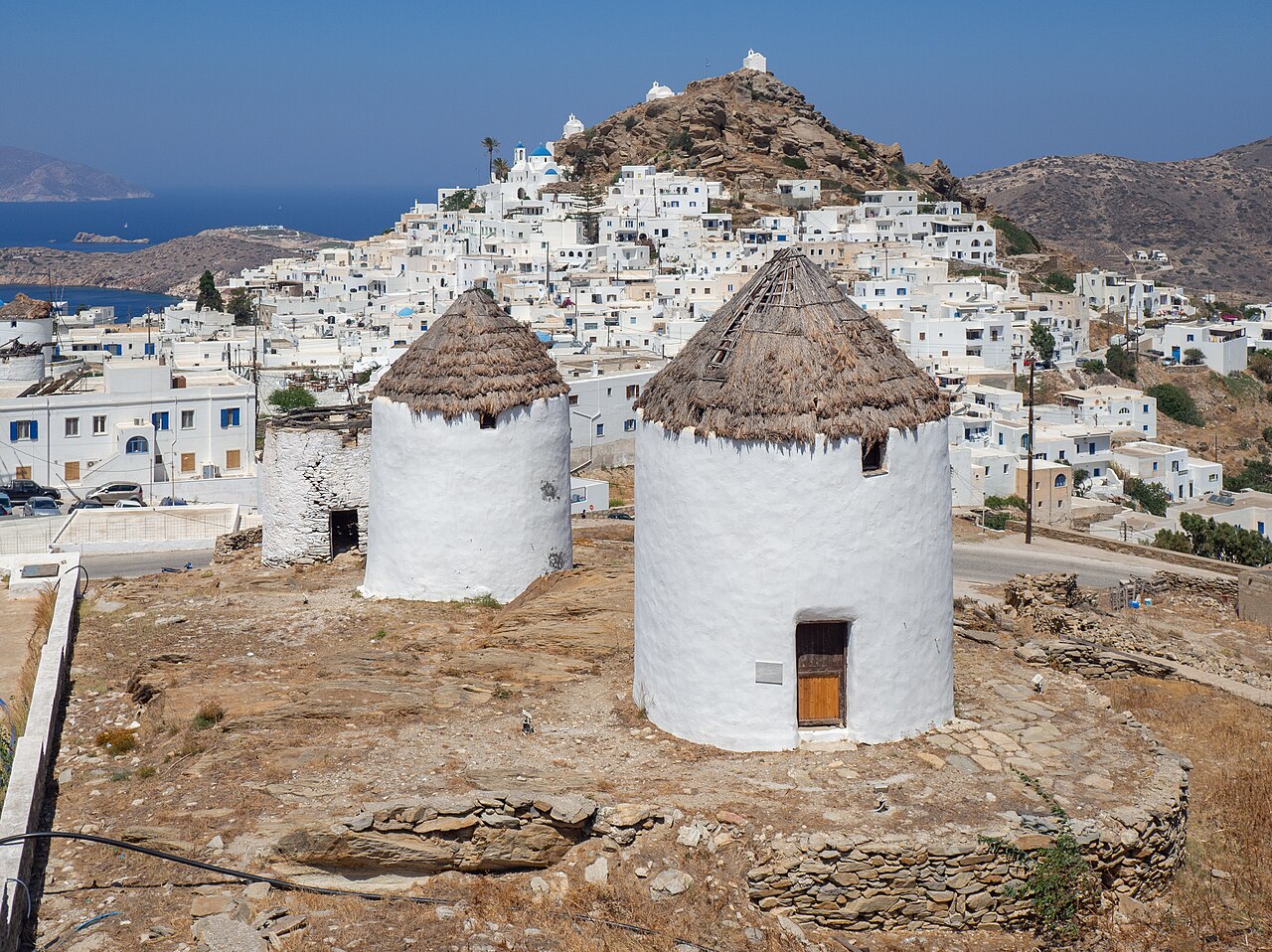Whitewashed houses and windmills of Chora on Ios island, Cyclades, seen from above