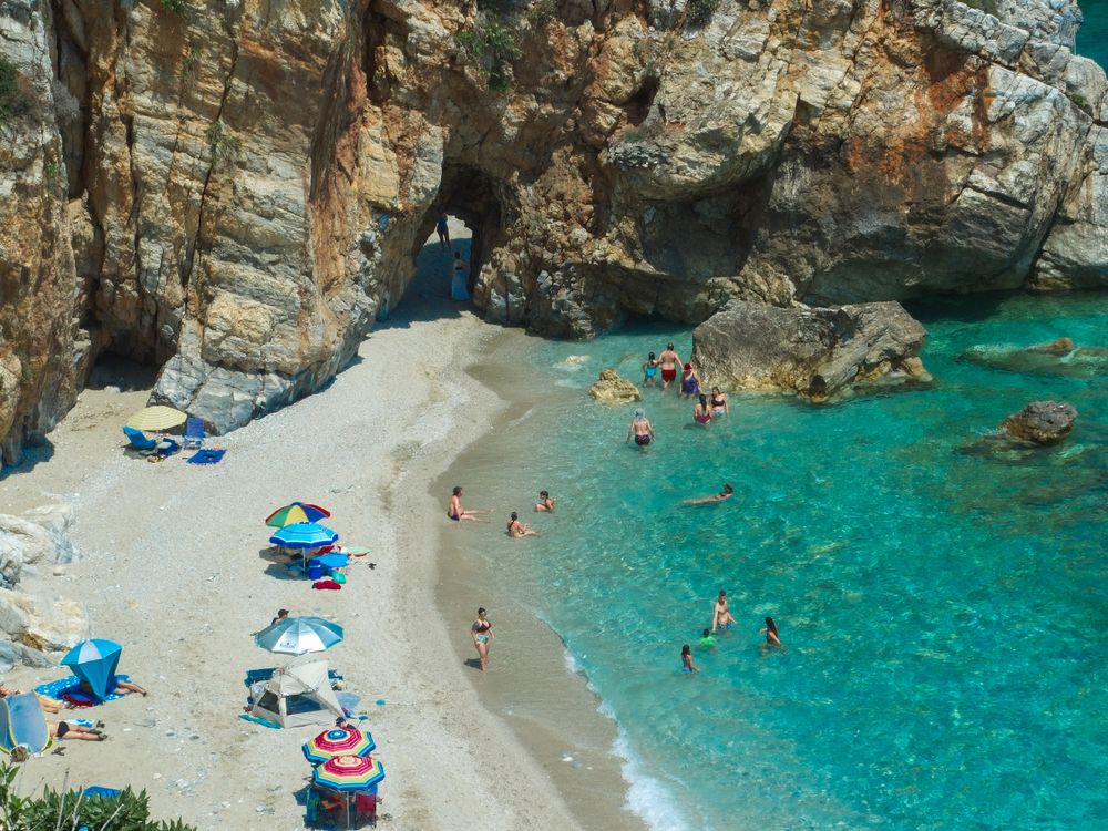 Aerial view of Mylopotas beach on Ios island showing turquoise water and golden sand