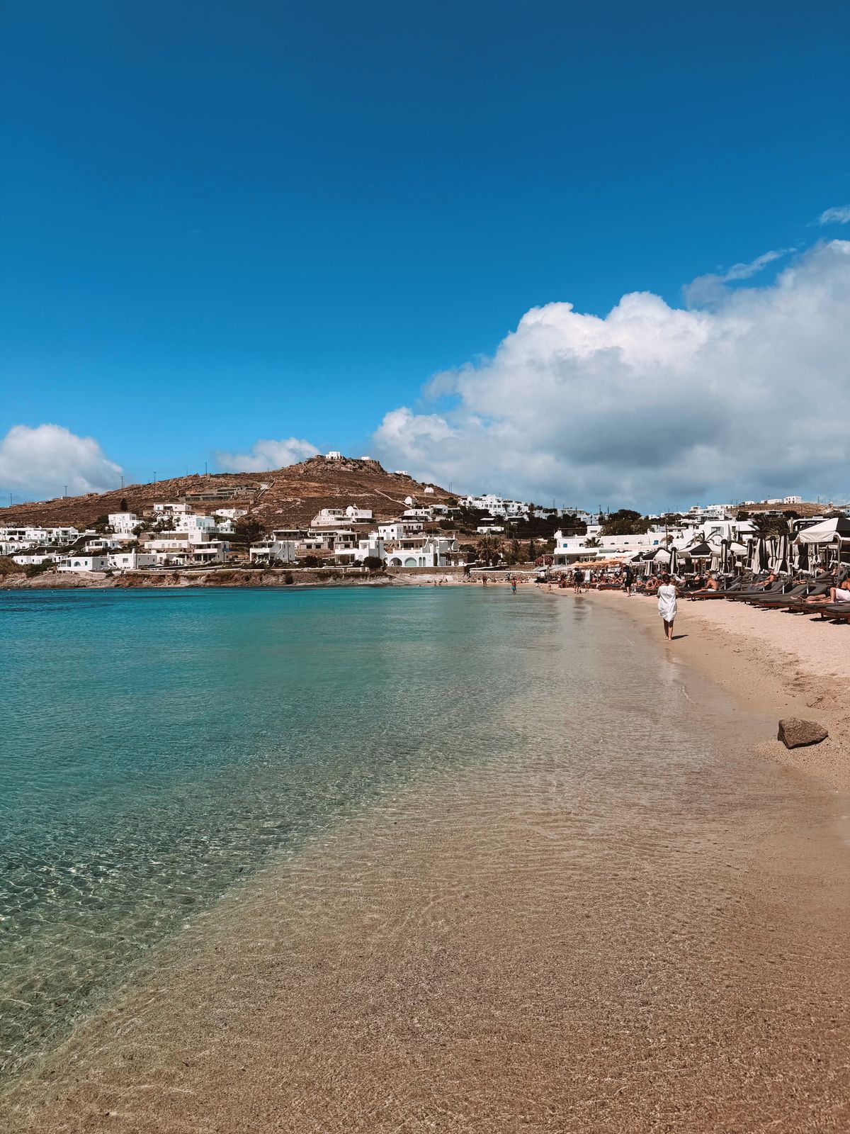 Scenic beach with clear turquoise waters in Mykonos, Greece