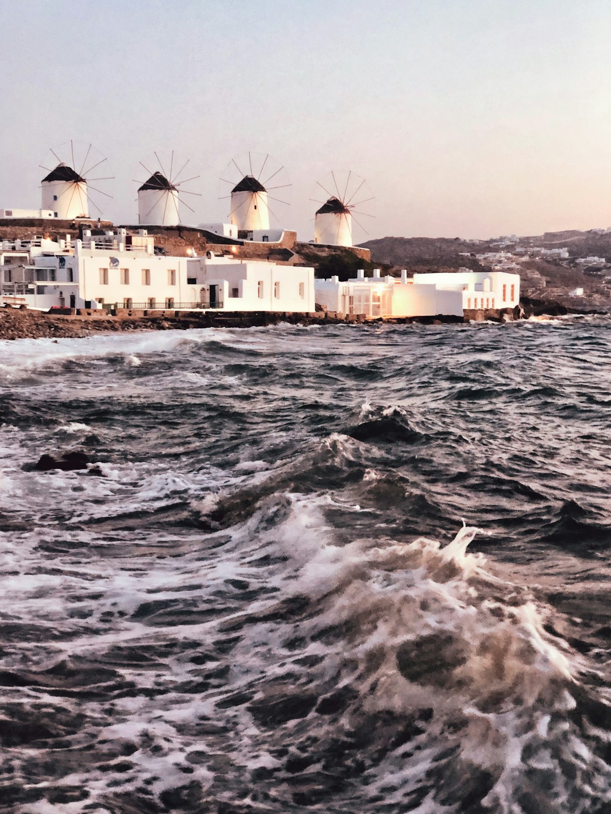 The iconic windmills of Mykonos overlooking the Aegean Sea