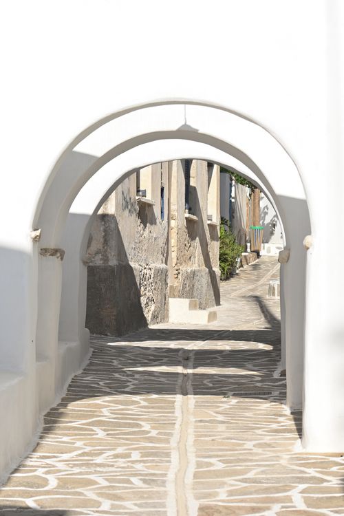 Stone archway over a narrow alley in the medieval village of Pyrgos, Santorini